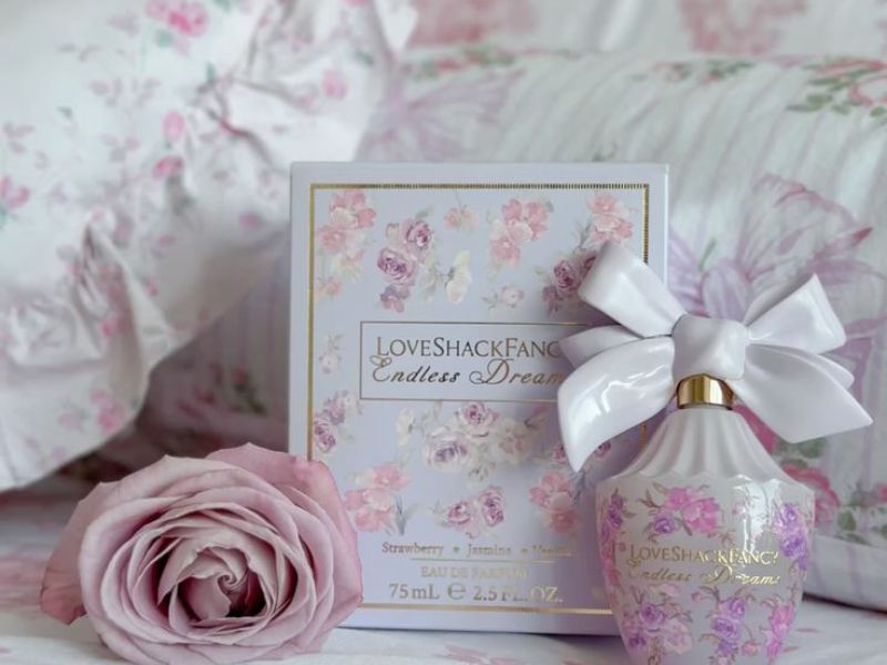 Beautiful LoveShackFancy perfume gift packaging with romantic floral aesthetic